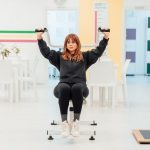 A woman exercising with weights indoors at a fitness facility in Yalova, Türkiye.