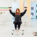 A woman exercising with weights indoors at a fitness facility in Yalova, Türkiye.